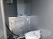 8.5' x 28' Charcoal Gray Porch Style Concession Trailer with Restroom