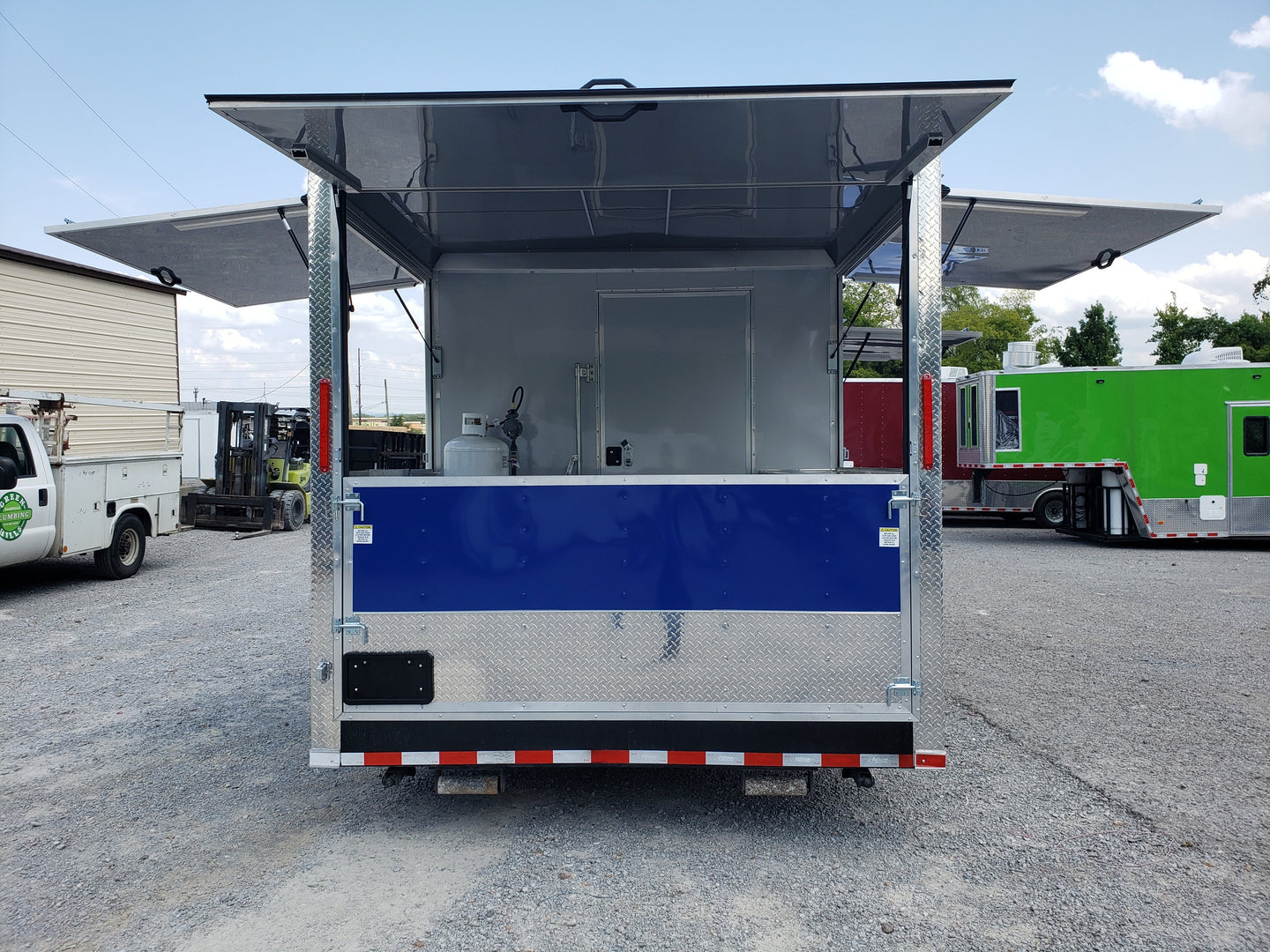 8.5' x 30' Black and Cobalt Blue Porch Style Concession Trailer