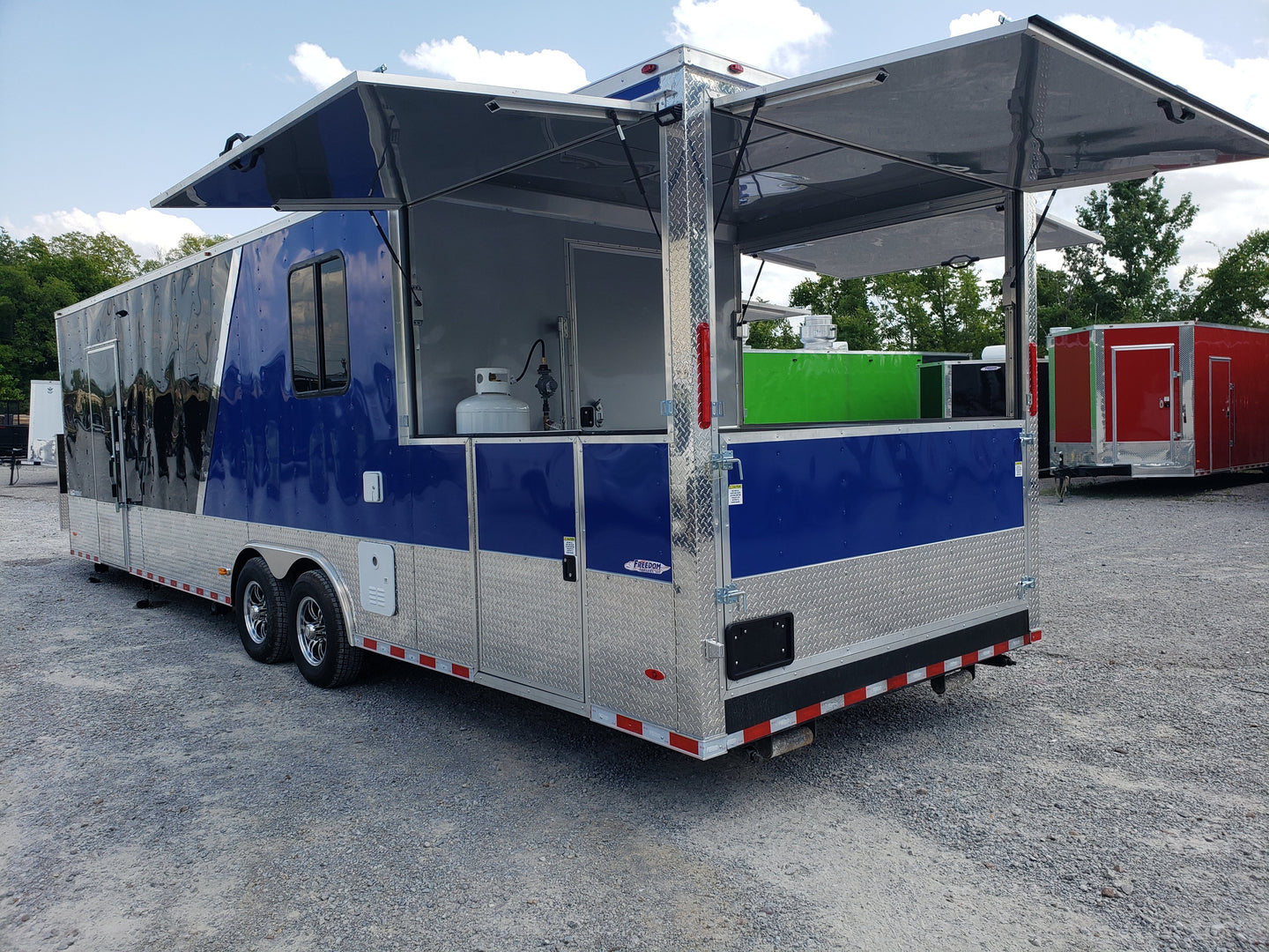 8.5' x 30' Black and Cobalt Blue Porch Style Concession Trailer