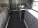 8.5' x 30' Black and Cobalt Blue Porch Style Concession Trailer