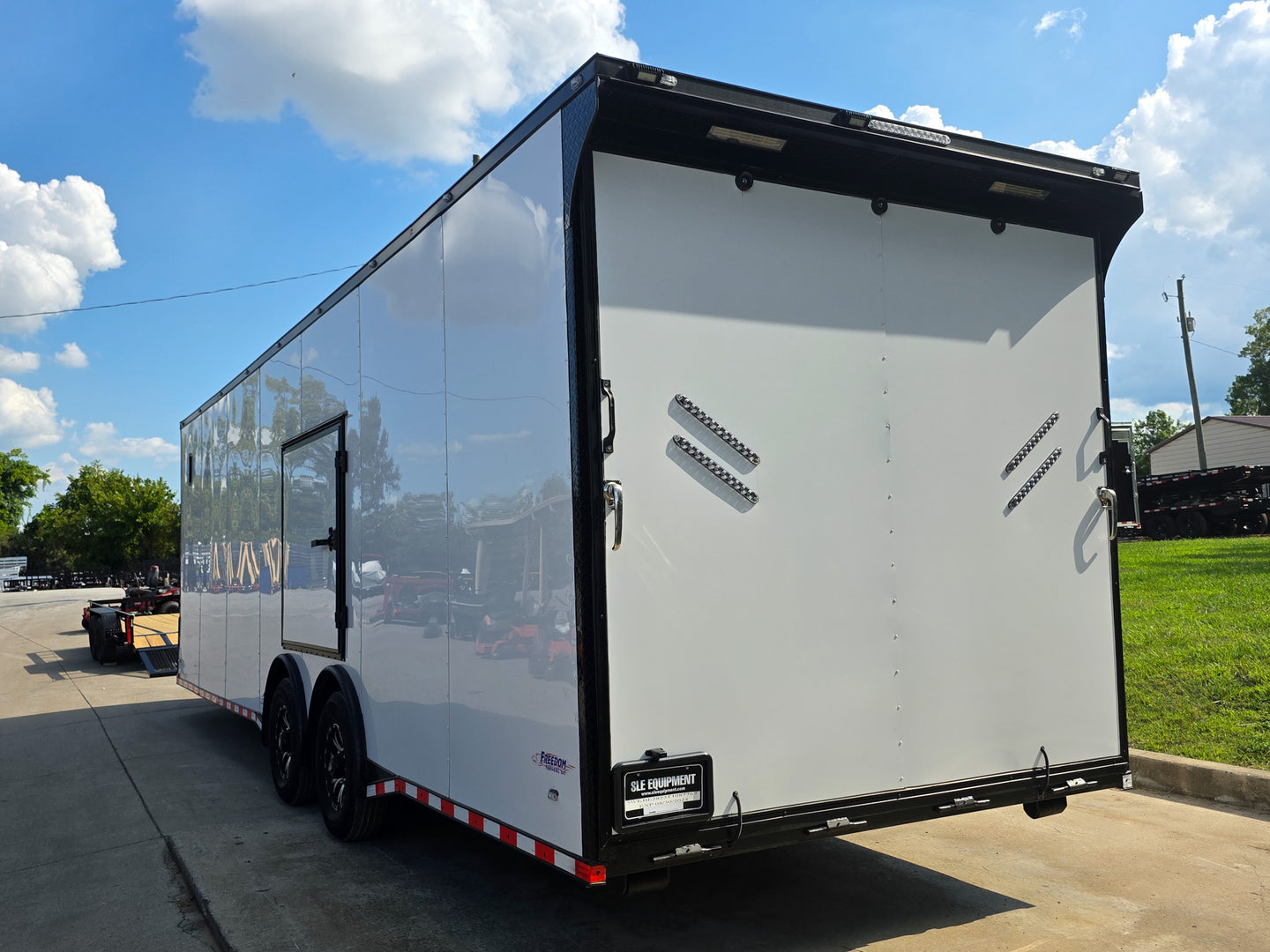 8.5x28 Enclosed Trailer Fully Loaded V Nose 30 Amp Elec. (2) 7,000LB Axle 14K GVWR Rear Left