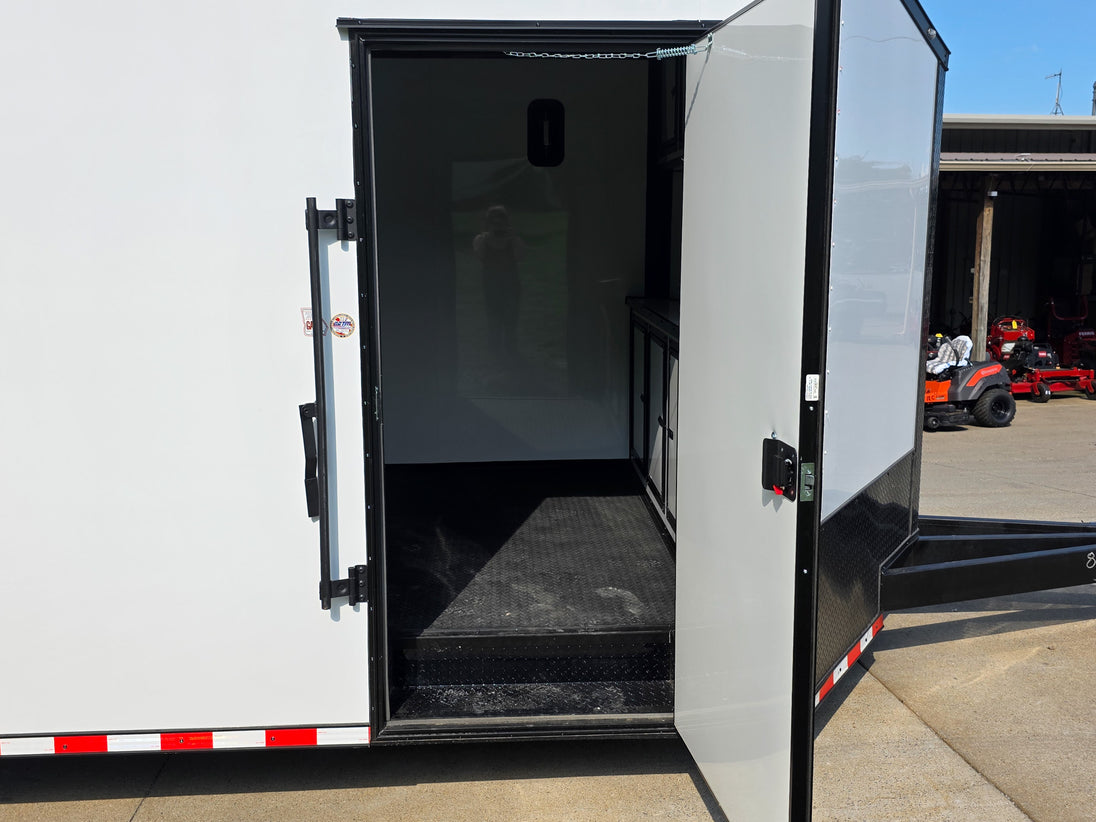 8.5x28 Enclosed Trailer Fully Loaded V Nose 30 Amp Elec. (2) 7,000LB Axle 14K GVWR Passenger Side Door