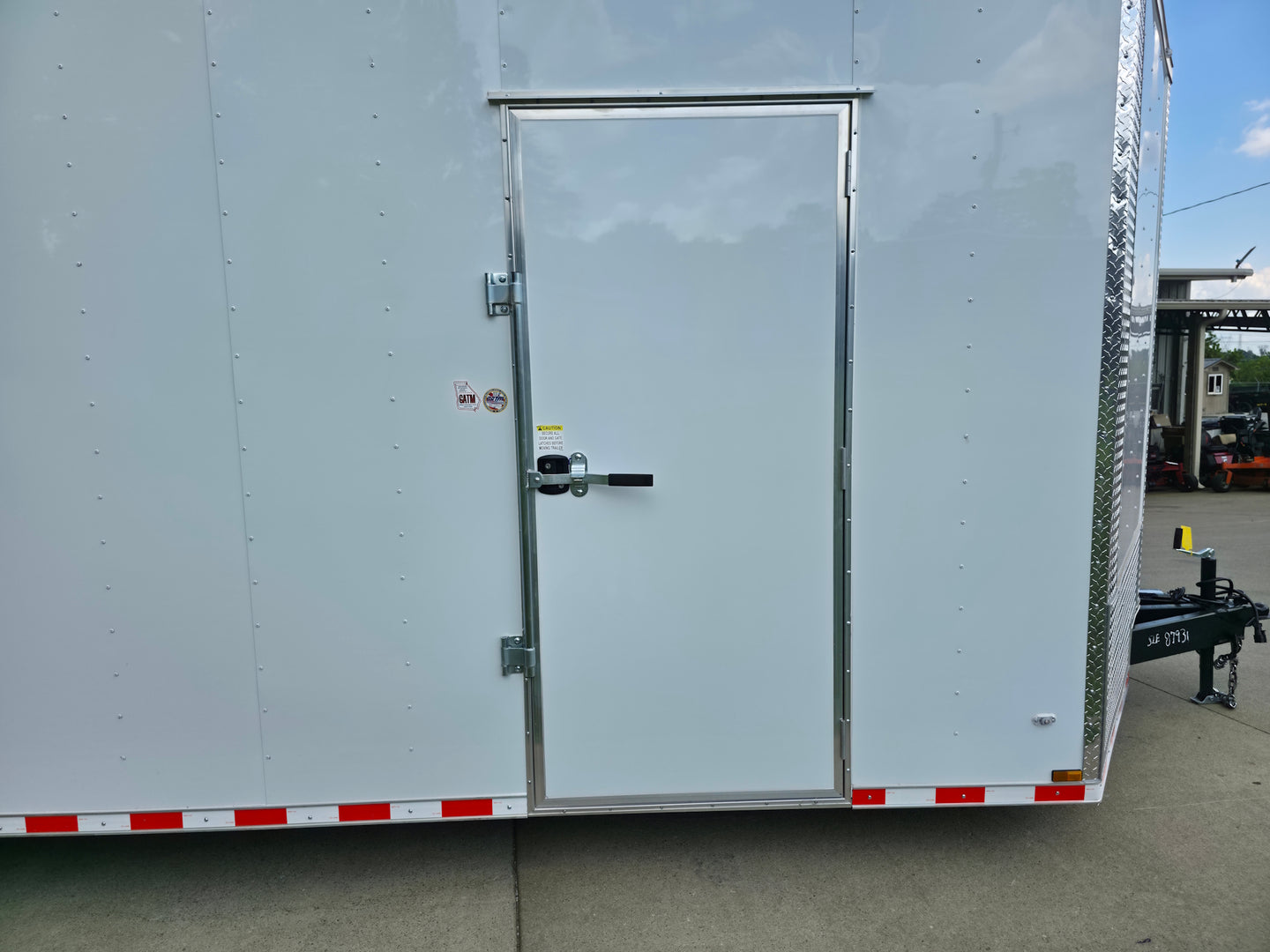 8.5x28 V Nose White Enclosed Trailer 7,000lb Axles Silver ATP Passenger Side Door