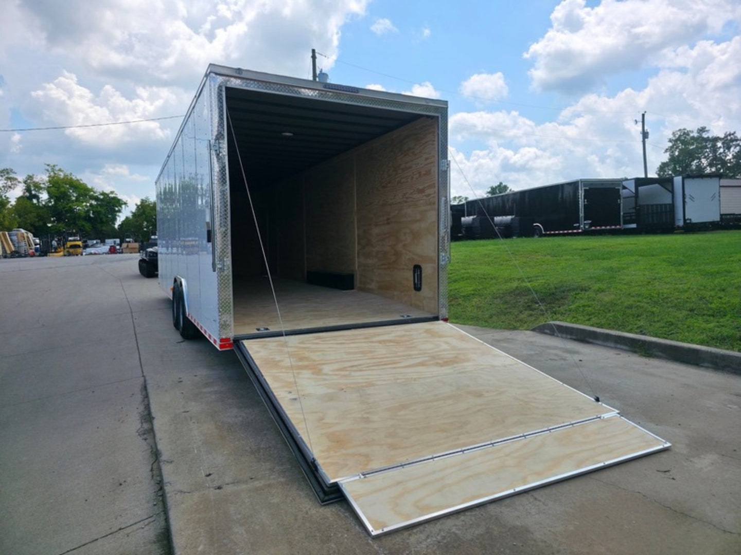 8.5x28 V Nose White Enclosed Trailer 7,000lb Axles Silver ATP Rear Left Ramp Open