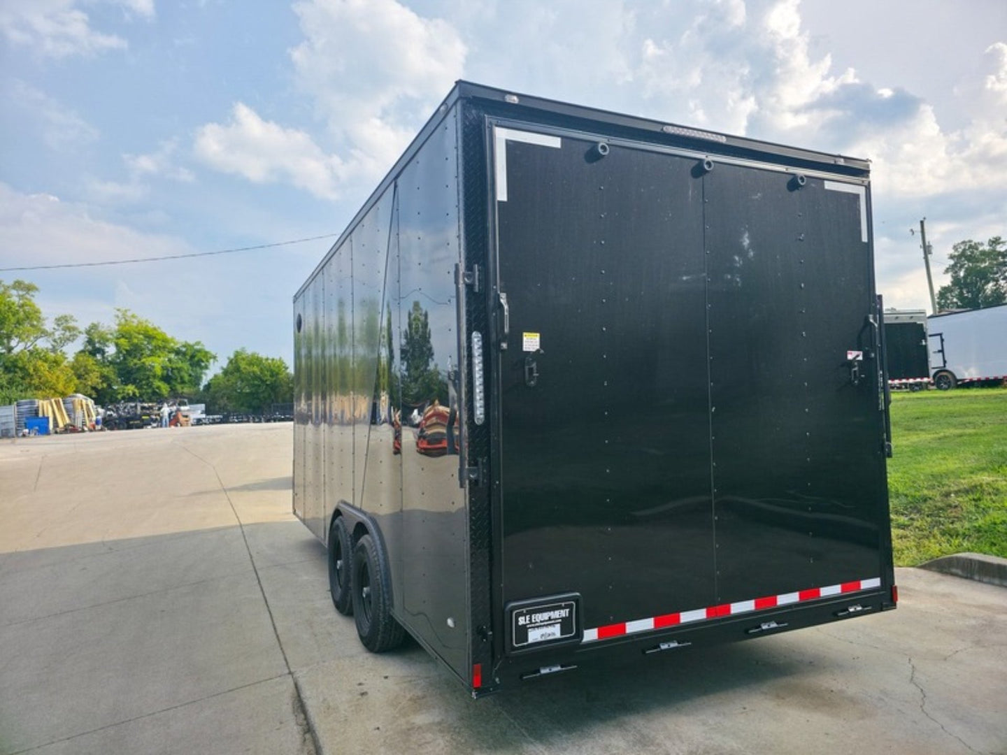 8.5 x 18 Charcoal/Black Enclosed Trailer with Blackout and (2) Heavy-Duty 5,200lb Axles Rear Left