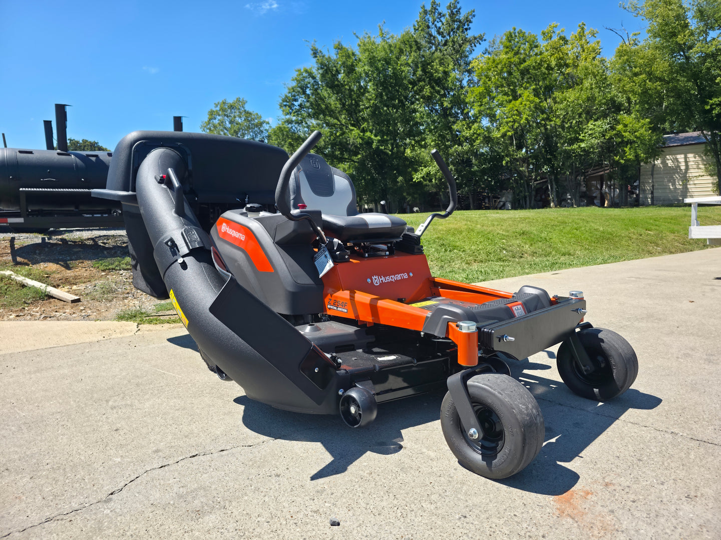 Husqvarna Z254F Special Edition Zero Turn Mower 23HP KAW with 591111401 Triple Bagger Front Left