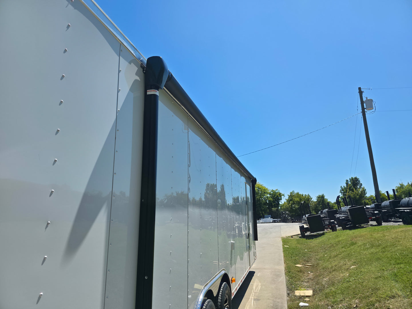 8.5x28 Flat Nose White Enclosed Trailer Roll Out Awning with AC Unit (2) 5,200LB Axles Awning Up