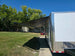 8.5x28 Flat Nose White Enclosed Trailer Roll Out Awning with AC Unit (2) 5,200LB Axles Awning Extended 