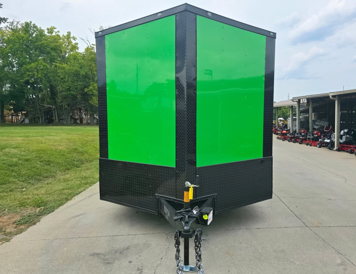 8.5x24 V Nose Neon Green Enclosed Trailer (2) 5200 LB Axles With Brakes 7 Ft Interior Height With Black Out Package Front 