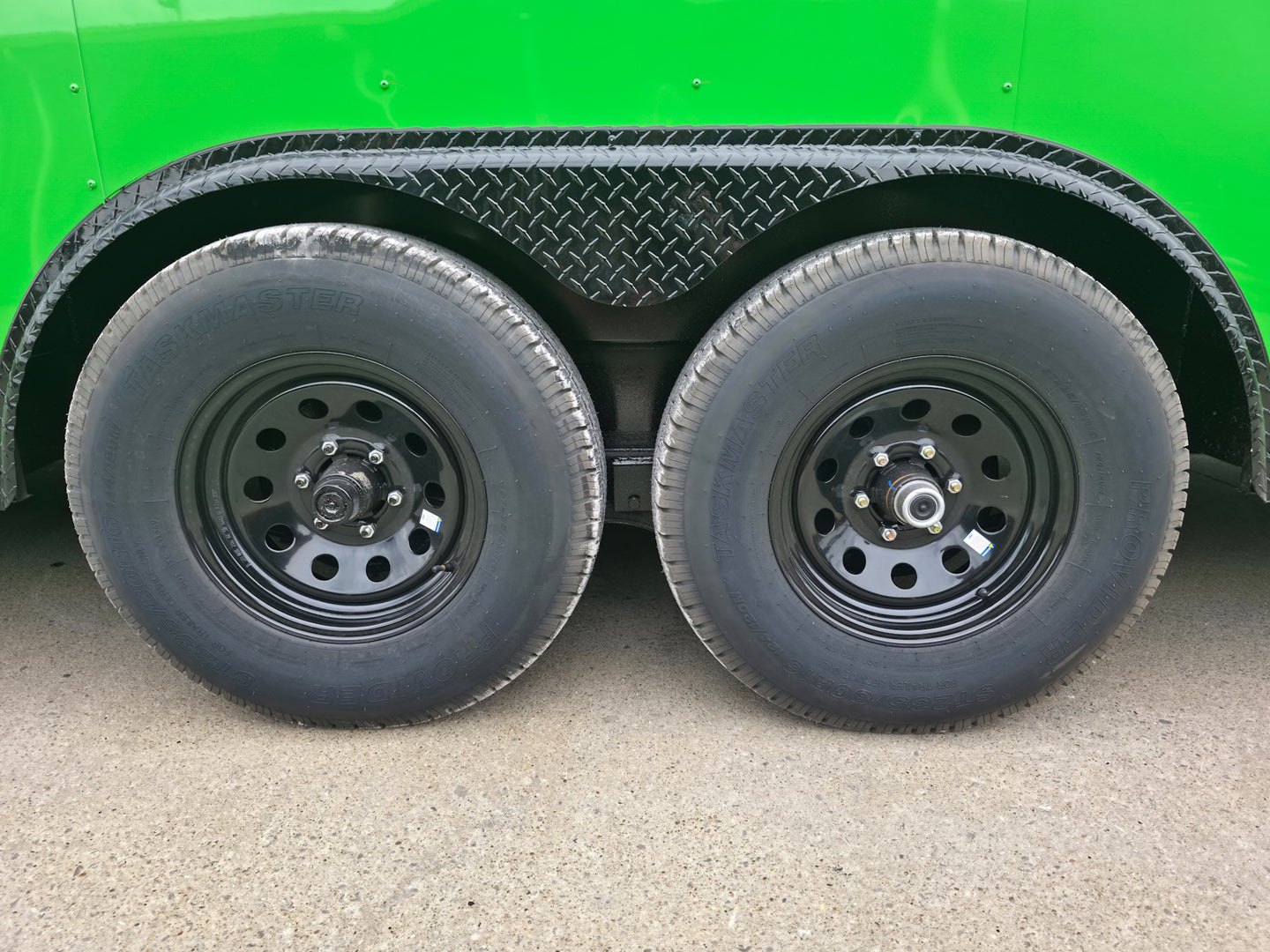 8.5x24 V Nose Neon Green Enclosed Trailer (2) 5200 LB Axles With Brakes 7 Ft Interior Height With Black Out Package Tires