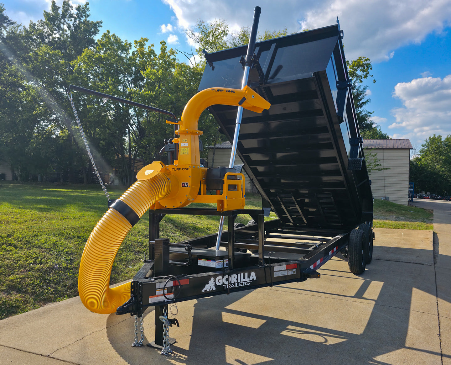 7x16x3 Gorilla Telescopic Dump Trailer 14k GVWR with Turf One Debri Loader 21HP V-Twin Front Left Tele Lifted