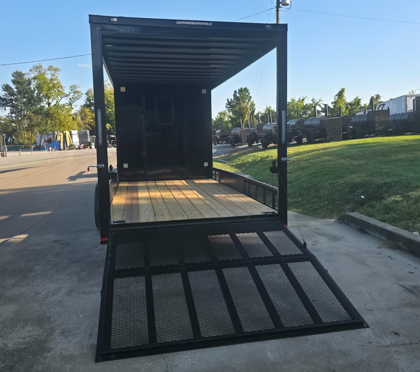 7x24 Black Hybrid Enclosed Trailer Aluminum Trim (2) 5200lb Axles Rear Gate Down 