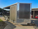 8.5x20 Charcoal Enclosed Hybrid Trailer with Gullwing (2) 3,500lb Axles Front Right