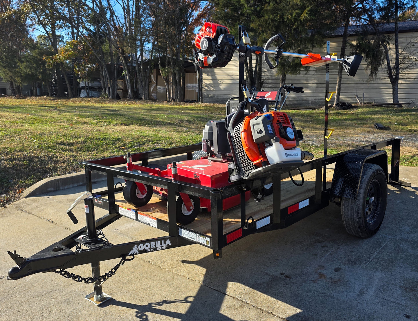 Encore EW32FS481V 32" Stand On Zero Turn Mower Handheld Utility with Racks Package Front Left 