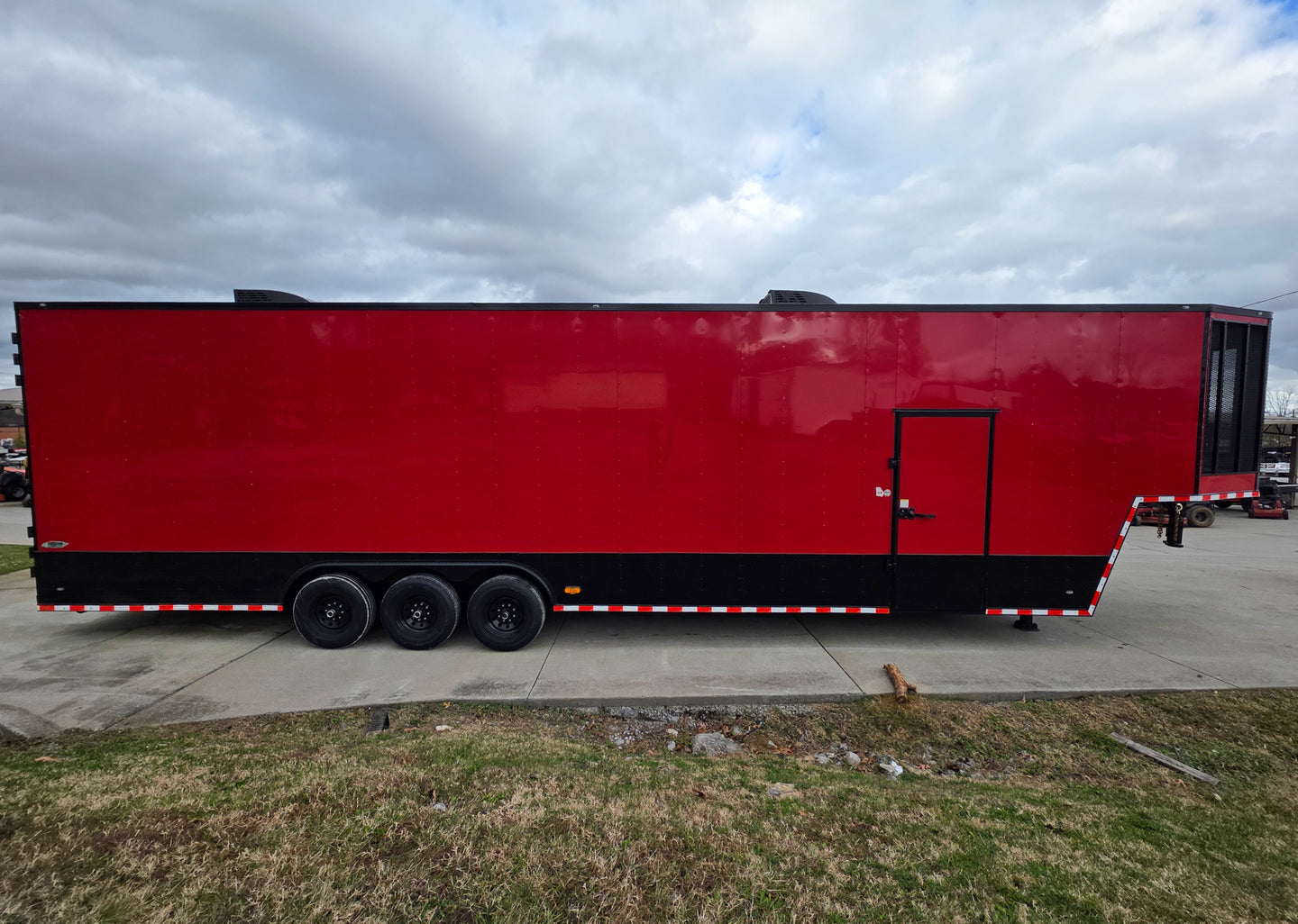 8.5x42 Red Gooseneck Enclosed Trailer Generator Cage with Rear Gullwing (3) 7000k Axles Right Side 