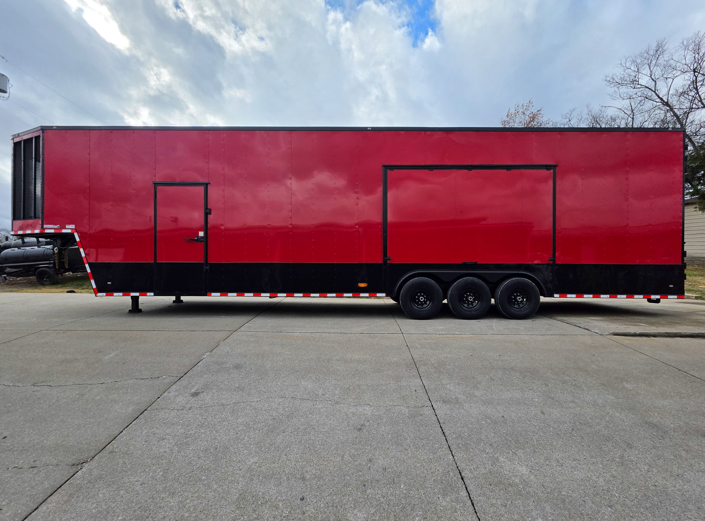8.5x42 Red Gooseneck Enclosed Trailer Generator Cage with Rear Gullwing (3) 7000k Axles Left ide 