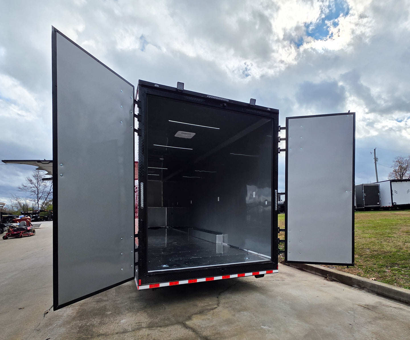 8.5x42 Red Gooseneck Enclosed Trailer Generator Cage with Rear Gullwing (3) 7000k Axles Left Rear Barn Doors Open