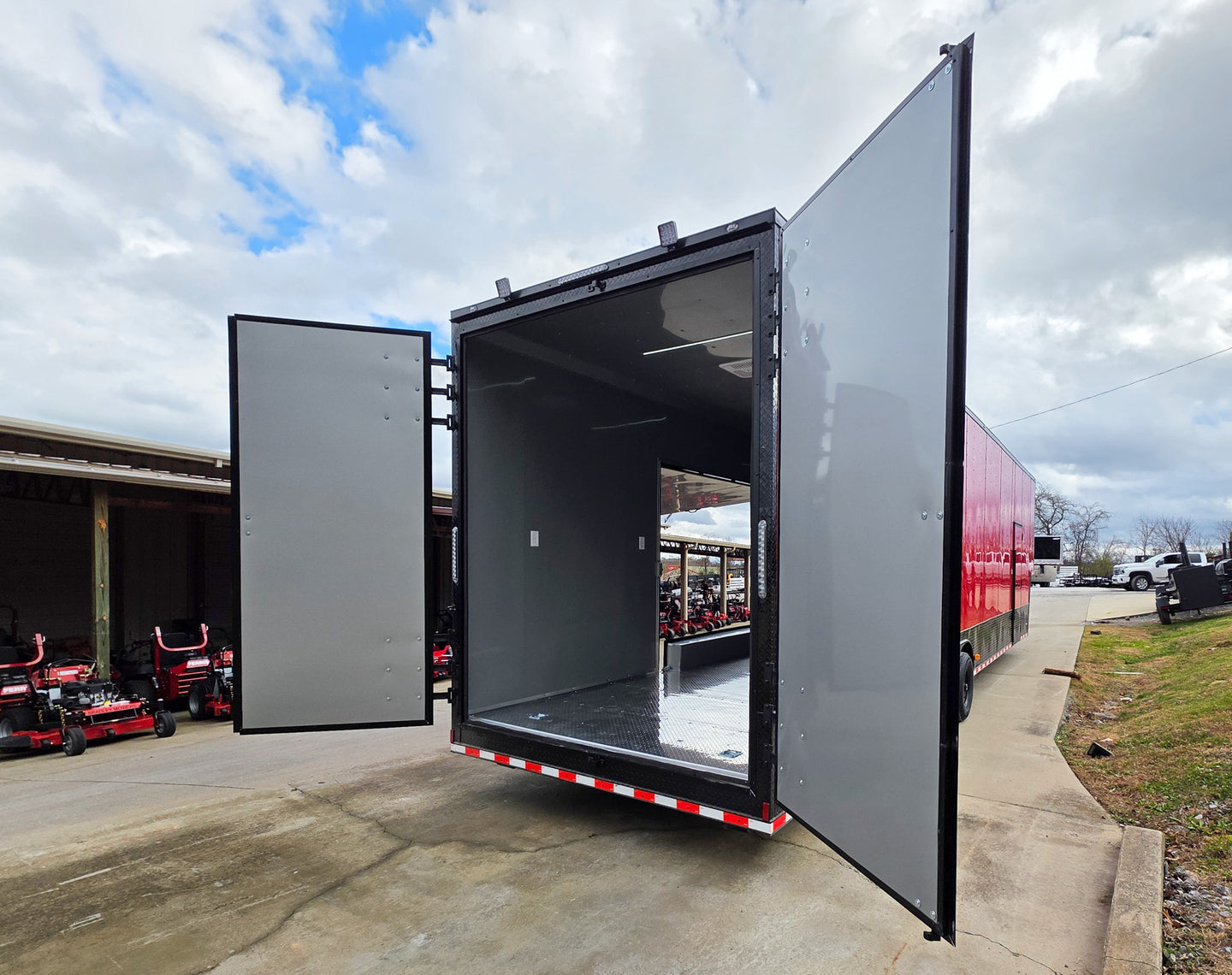 8.5x42 Red Gooseneck Enclosed Trailer Generator Cage with Rear Gullwing (3) 7000k Axles Rear Right Barn Doors Open