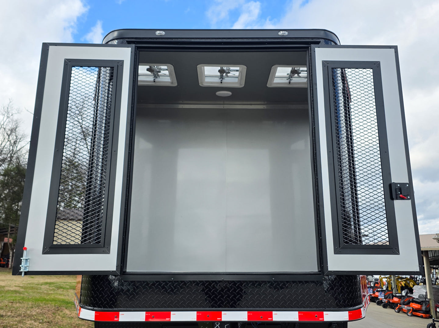 8.5x42 Red Gooseneck Enclosed Trailer Generator Cage with Rear Gullwing (3) 7000k Axles Front Generator Cage Doors Open