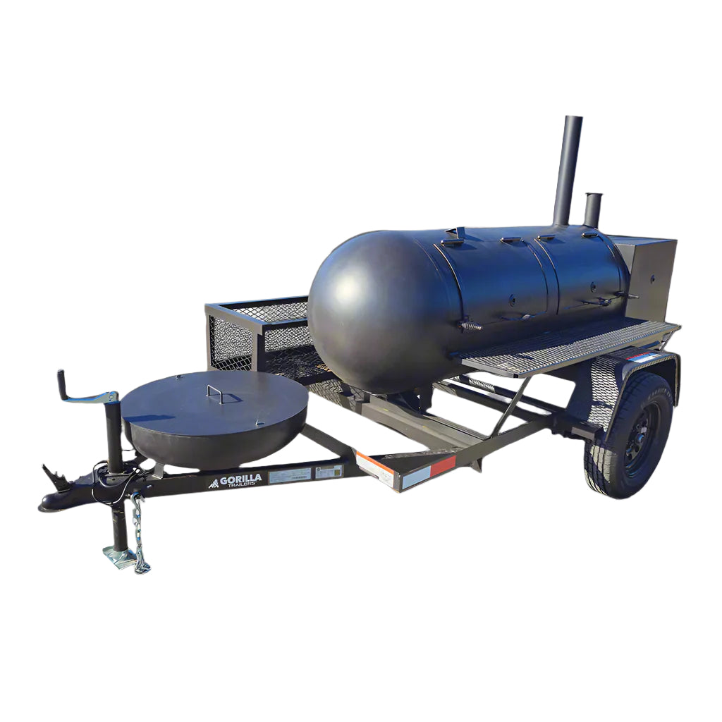 A black pull behind BBQ smoker with a round shape and a smaller round shape attached to it, mounted on a trailer with a Dexter axle.