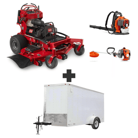 Toro GrandStand 48" stand-on mower bundle with Husqvarna 150BT blower, 122L trimmer, and 6x12 V-nose enclosed trailer.
