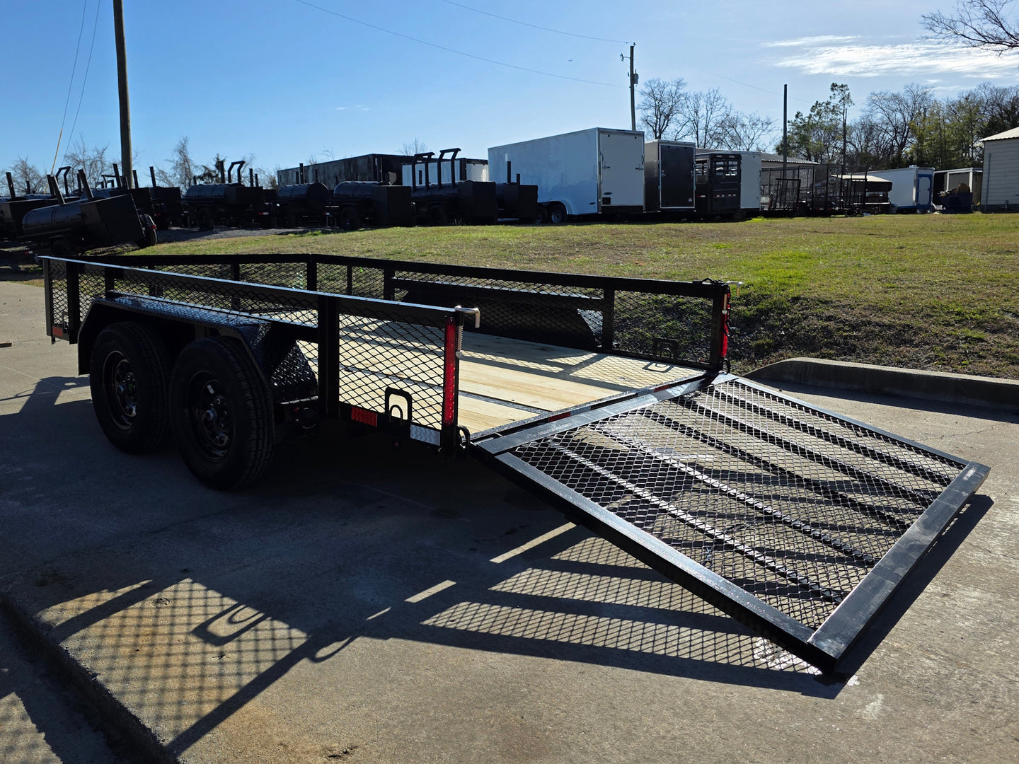 7' X 12' Straight Deck Utility Trailer 18IN Mesh Sides Double Axle 7K GVWR back left angled view picture with ramp down 