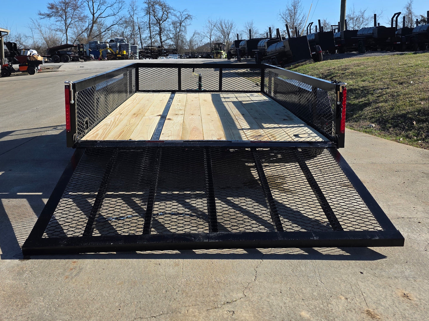 7' X 12' Straight Deck Utility Trailer 18IN Mesh Sides Double Axle 7K GVWR back view picture with ramp down 