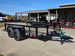 7' X 12' Straight Deck Utility Trailer 18IN Mesh Sides Double Axle 7K GVWR front left angled view picture with ramp down 