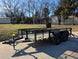 7' X 12' Straight Deck Utility Trailer 18IN Mesh Sides Double Axle 7K GVWR front right angled view picture with ramp down 