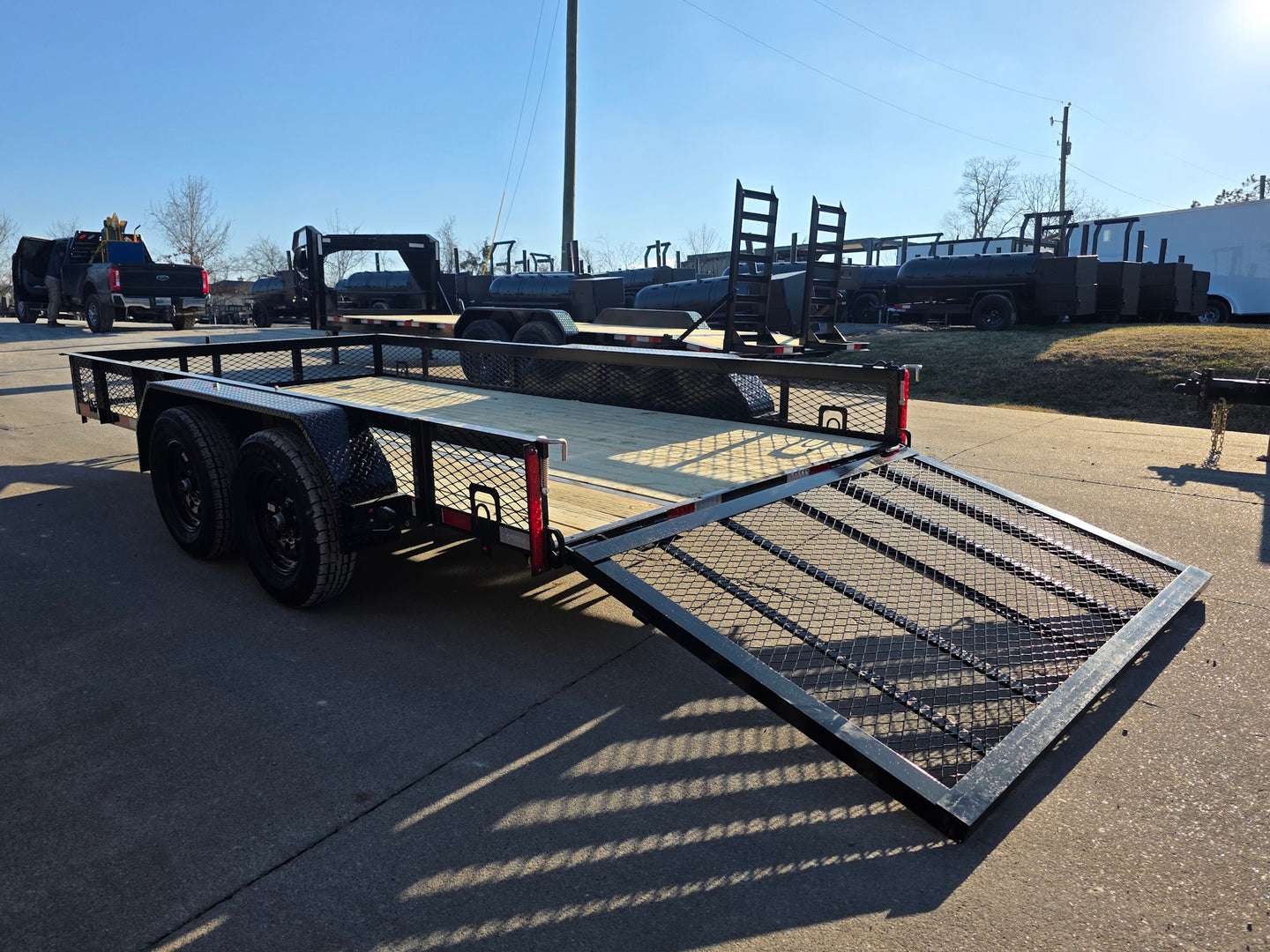 7 X 14 Straight Deck Utility Trailer With 12" Mesh Sides (2) 3,500lb Axles back left angled view picture with ramp down