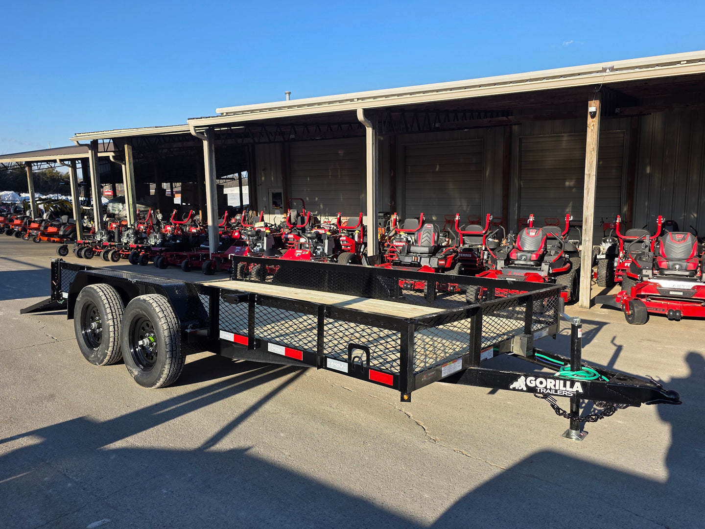 7 X 14 Straight Deck Utility Trailer With 12" Mesh Sides (2) 3,500lb Axles front left angled view picture with ramp down 