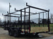 7x16 Straight Deck (2) 5200lb axles 2ft mesh 6ft ladder racks Back left angle picture 