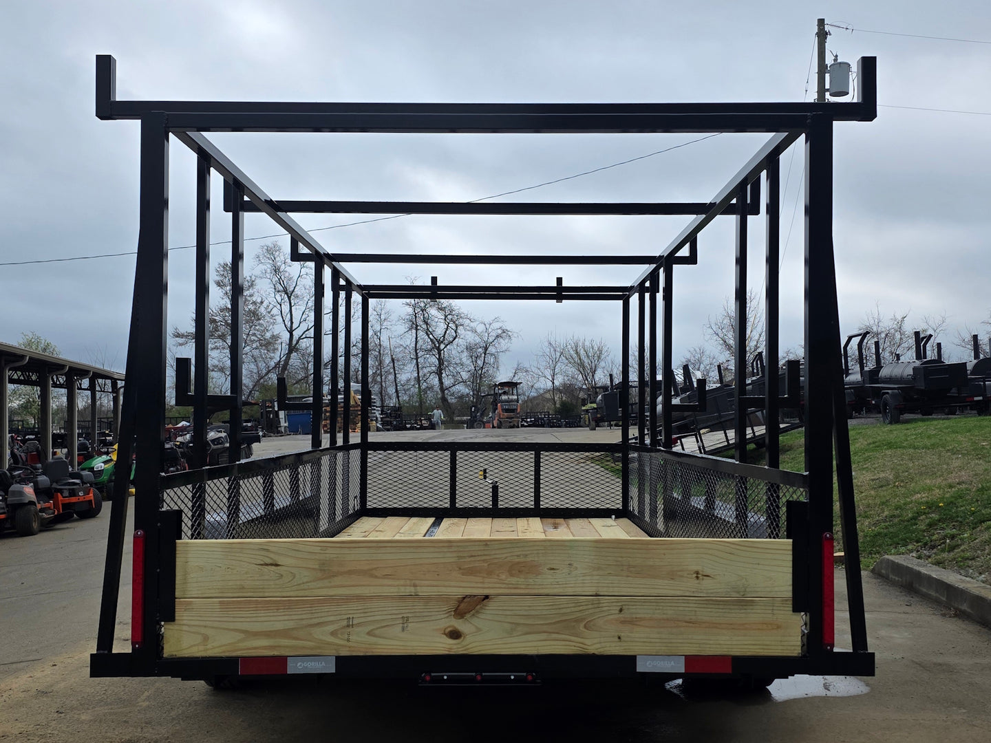 7x16 Straight Deck (2) 5200lb axles 2ft mesh 6ft ladder racks Back side picture 