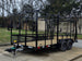 7x16 Straight Deck (2) 5200lb axles 2ft mesh 6ft ladder racks Front right angle picture 