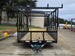 7x16 Straight Deck (2) 5200lb axles 2ft mesh 6ft ladder racks Front side picture 