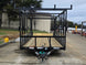 7x16 Straight Deck (2) 5200lb axles 2ft mesh 6ft ladder racks Front side picture 