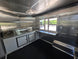 8.5’ X 16’ White Mobile kitchen food event concession trailer w/ 6’ Porch Interior back right angle picture 