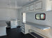 8.5' X 20' Charcoal Grey Custom Enclosed Trailer Mobile Office and Command Center Interior back left angle picture 