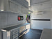 8.5' X 20' Charcoal Grey Custom Enclosed Trailer Mobile Office and Command Center Interior front right angle picture 