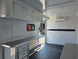 8.5' X 20' Charcoal Grey Custom Enclosed Trailer Mobile Office and Command Center Interior front right angle picture 