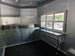 8.5' X 20' Food Event Concession Trailer with 6' Screened Porch Interior back left angle picture 