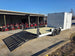 8.5_X_22_Hybrid_Enclosed_Trailer_With_30amp_Electric_Package_2_5_200lb_Axles_back_right_angled_picture_with_ramp_down_13