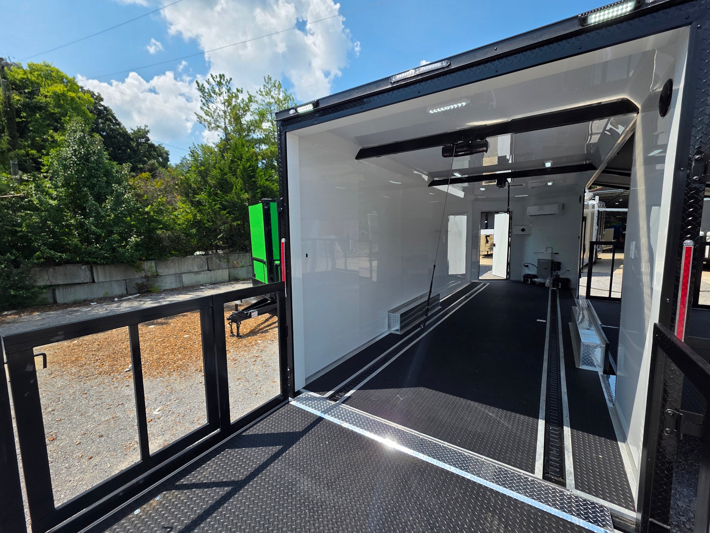 8.5' X 24' Black Custom Enclosed Trailer For Marketing and Showcase Events Back porch back right angle picture 