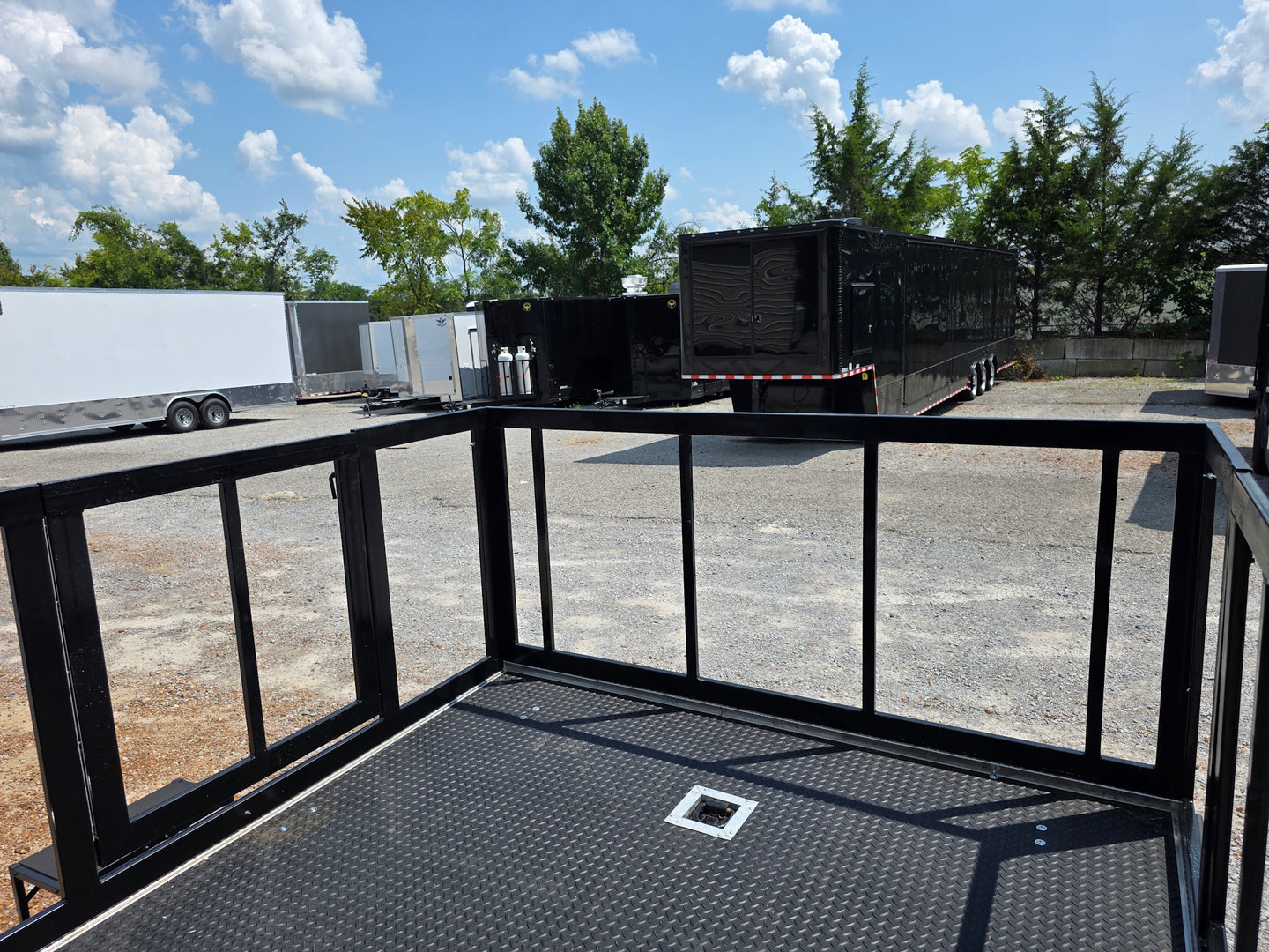 8.5' X 24' Black Custom Enclosed Trailer For Marketing and Showcase Events Back porch front right angle picture 