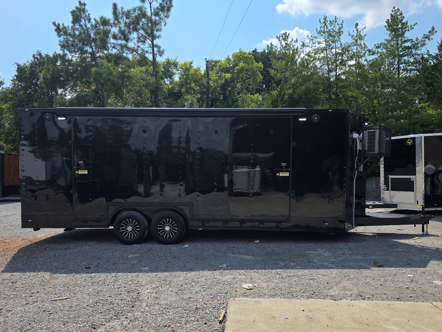 8.5' X 24' Black Custom Enclosed Trailer For Marketing and Showcase Events Left side picture 