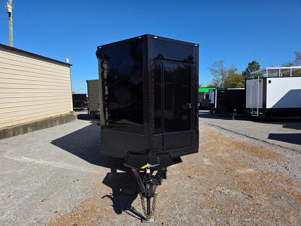 8.5' X 24' Black With Blackout Custom Stage Trailer Front Facing Picture