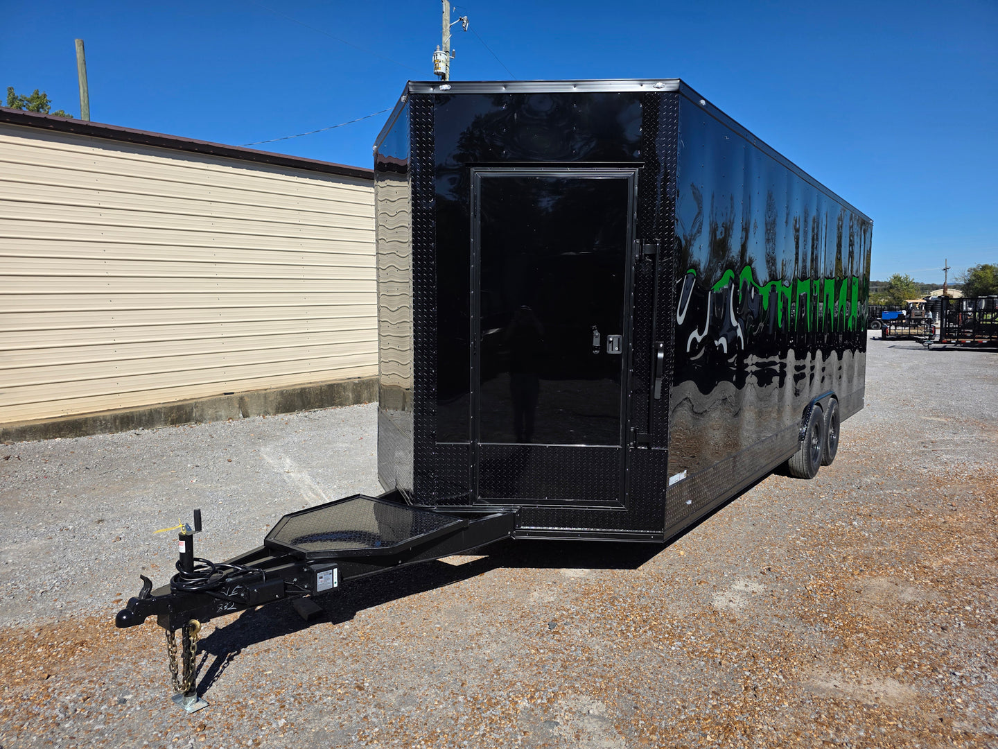 8.5' X 24' Black With Blackout Custom Stage Trailer With Awning Front Drivers Side Angle
