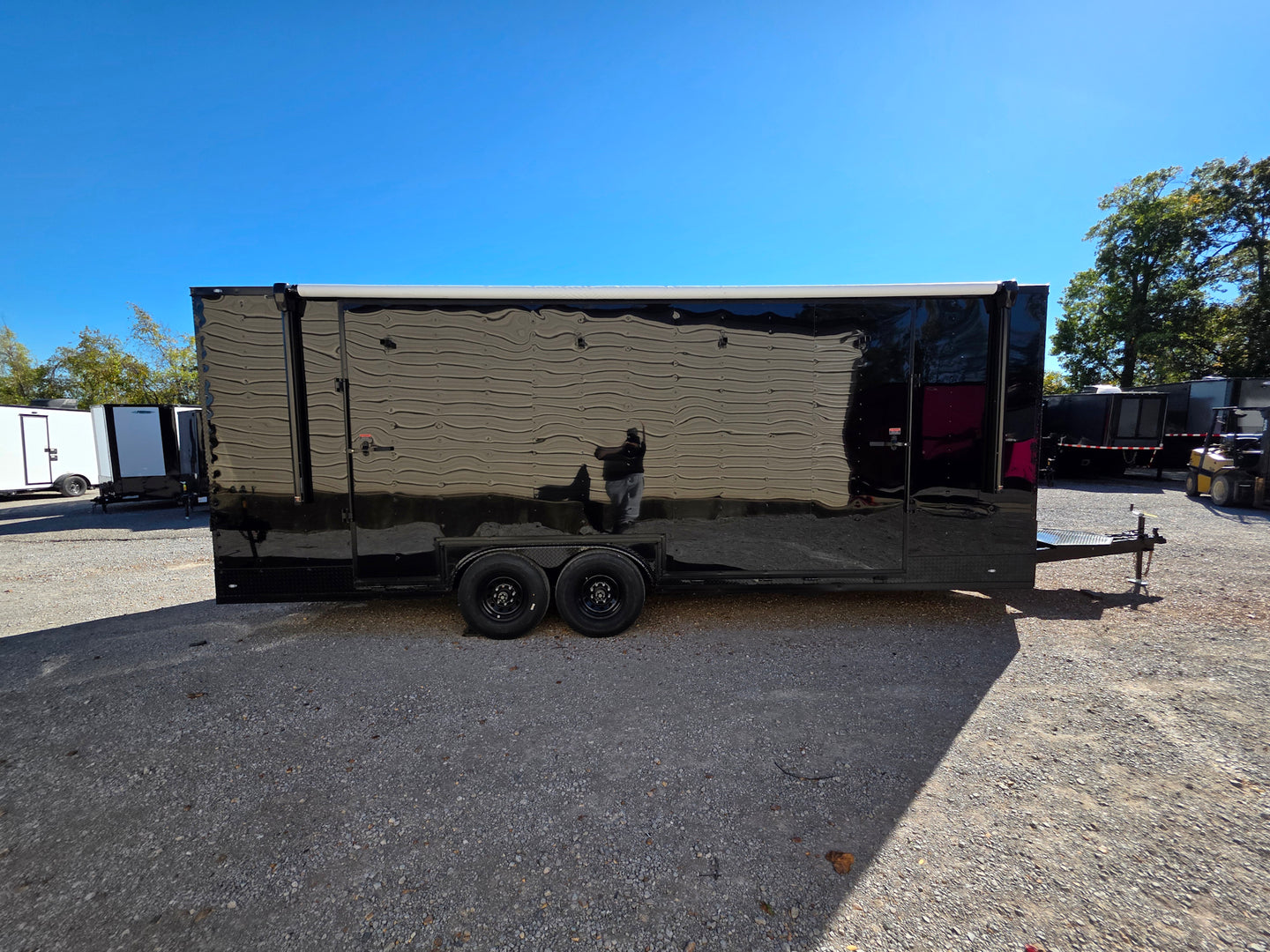 8.5' X 24' Black With Blackout Custom Stage Trailer With Awning Passenger Side Shot