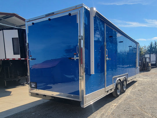 8.5' X 24' Cobalt Blue Stage & Event Marketing Concession Trailer Passenger Side Rear Angle Trailer Closed