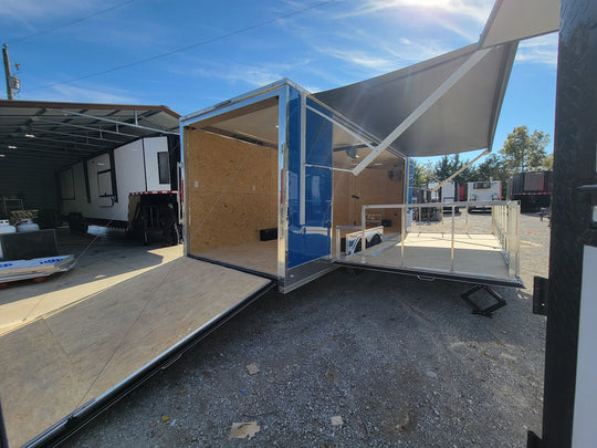 8.5' X 24' Cobalt Blue Stage & Event Marketing Concession Trailer Passenger side rear with stage out and ramp out